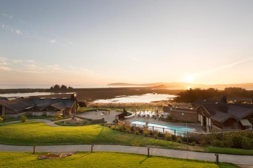 an aerial view of a resort with a body of water at The Lodge at Bodega Bay in Bodega Bay
