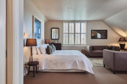 a bedroom with a bed and a living room at Briarwood in Greytown