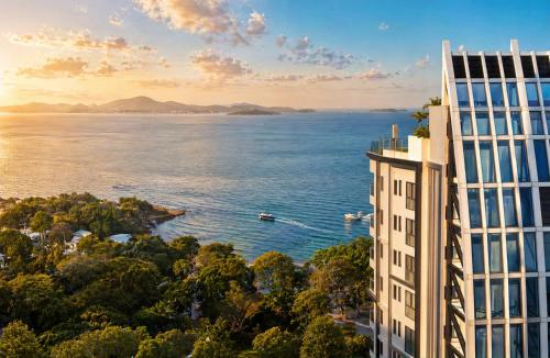 a rendering of a building with a view of the ocean at The Elysium Prațumnak Pattaya - By SHG in Pattaya South