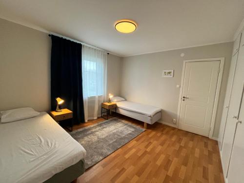 a small bedroom with a bed and a window at Villa Lindäng Apartment -Vimmerby in Vimmerby