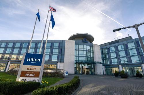a building with flags in front of it at Hilton Reading in Reading
