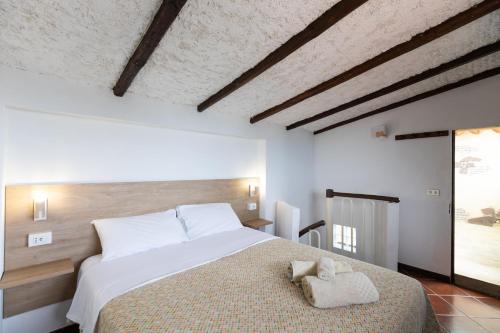 a bedroom with a large bed in a room at Camping Residence Costa Verde in Ricadi