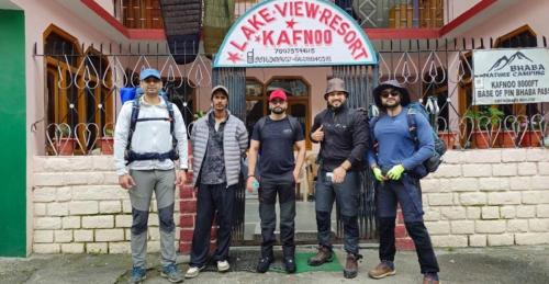 a group of men standing in front of a store at lake view resort kafnoo in Yangpa
