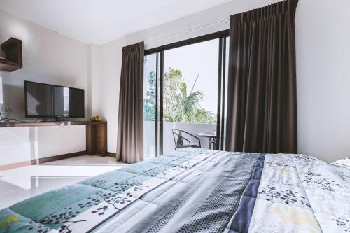 Katil atau katil-katil dalam bilik di Ra Residence Phuket