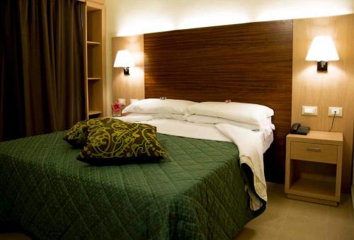 Letto o letti in una camera di Hotel Dei Tigli