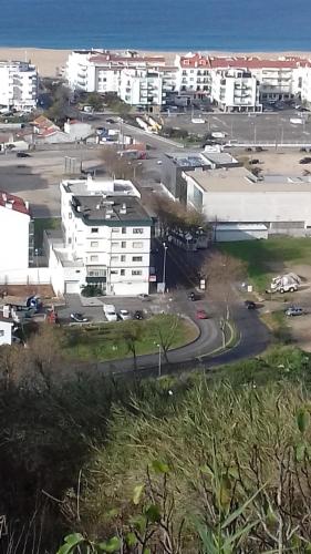 an aerial view of a parking lot with buildings at Casa Romão in Nazaré