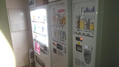 a vending machine with drinks inside of it at Onomichi View Hotel Seizan in Onomichi
