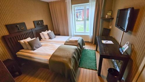 Katil atau katil-katil dalam bilik di Fredensborgs Herrgård