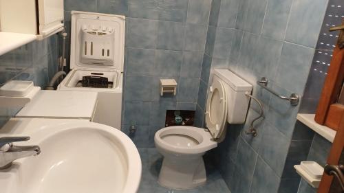 a small bathroom with a toilet and a sink at Casa Carmela in Sapri