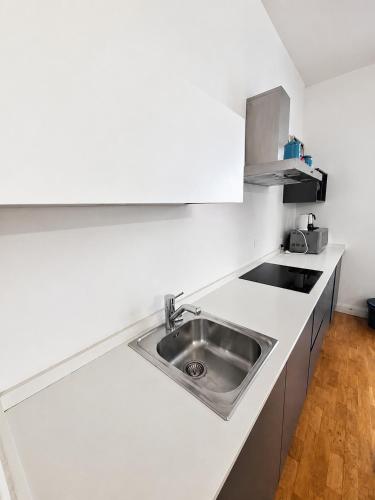 a kitchen with a sink and a counter top at Dimora storica - Palazzo Barabesi in Siena