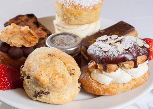 a plate of pastries and desserts on a table at Wildes Inns in Chesterfield