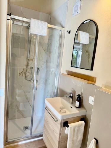 a bathroom with a shower and a sink at Casetta di Dodo - Charm Toscano in Centro in Collesalvetti