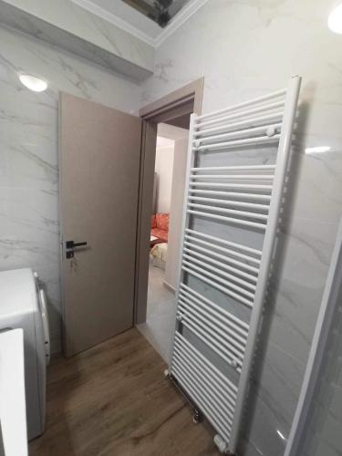 a room with a closet with a door and a heater at Pierres Blanches Center in Mytilene