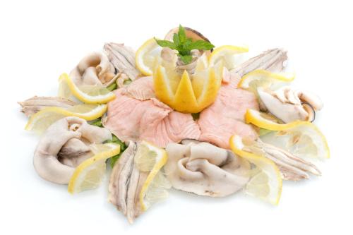 a plate of food with oysters and lemon slices at Hotel Weber Ambassador in Capri