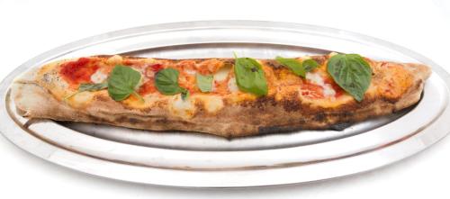 a slice of pizza on a white plate at Hotel Weber Ambassador in Capri