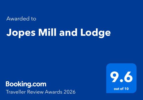 a blue screen with the words logs mill and lodge at Jopes Mill and Lodge in Looe