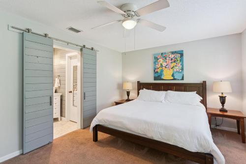 a bedroom with a bed and a ceiling fan at Harbour Oaks, Unit 419 in Saint Simons Island
