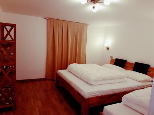 Posteľ alebo postele v izbe v ubytovaní Apartment San Colombano