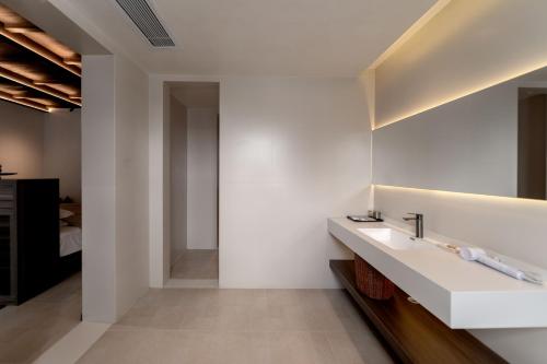 a bathroom with a sink and a mirror at 大理洱畔民宿 in Dali