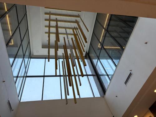 a ceiling view of a room with a chandelier at Garden Hotel in Kuwait