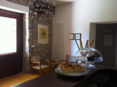 a room with a table with a plate of food at Taverna Centomani in Potenza