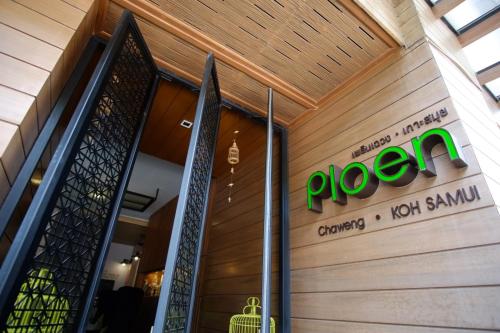 a sign on the front of a door of a store at Ploen Chaweng by Tolani in Chaweng