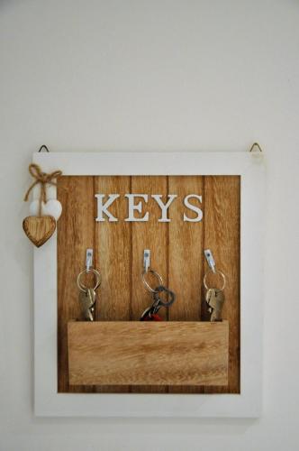 a picture of a wooden box with keys on it at Nonna Rina b&b in Savona