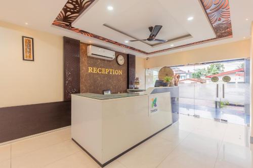 a reception area of a hotel with a reception desk at Treebo Hotel Mobi VIP Airport in Guwahati
