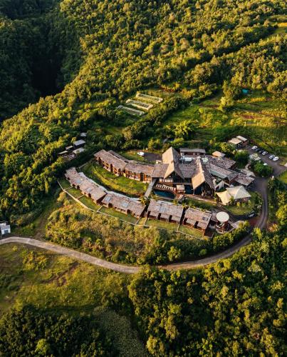 an aerial view of a house on a hill at Hôtel Diana Dea Lodge & SPA in Sainte-Anne-les Hauts