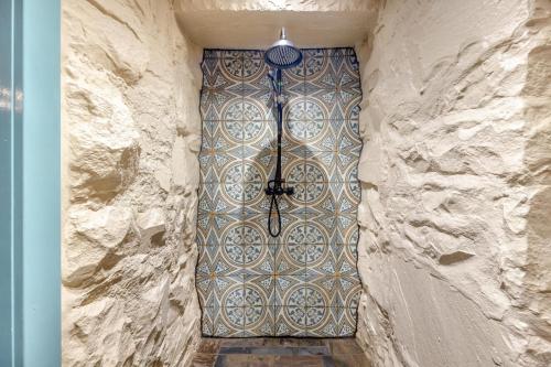 a stone wall with a door in a stone wall at Y Cwtch - Panoramic mountain views within Snowdonia's National Park - 4x4 only in Dolgellau