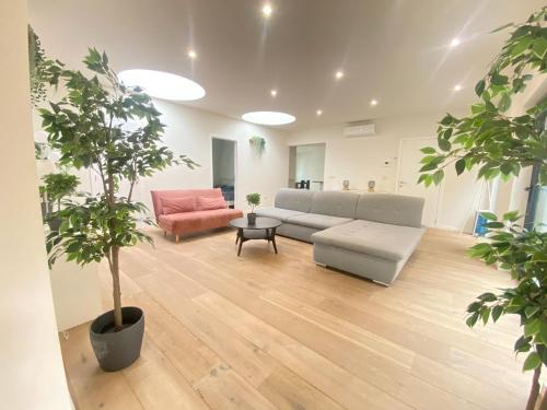 a living room with a couch and a table at 12-Guest Apartment on the Main Square in Antwerp