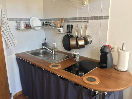 a kitchen with a sink and a counter top at Chez Nahiko STUDIO Paris Massy Palaiseau in Palaiseau