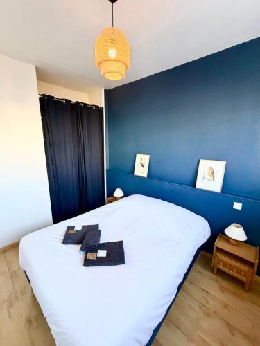 เตียงในห้องที่ Le Petit Royan