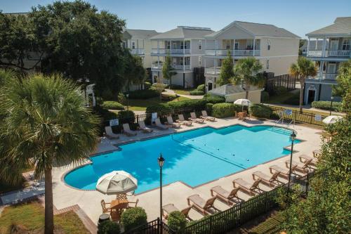 an overhead view of a swimming pool with lounge chairs at Ocean Ridge Resort 2BR Apartment in Edisto Island