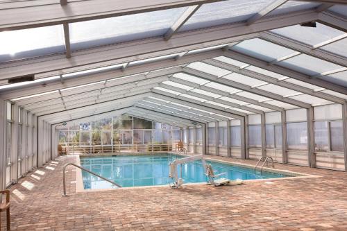 a large swimming pool with a large ceiling at Ocean Ridge Resort 4BR Apartment in Edisto Island