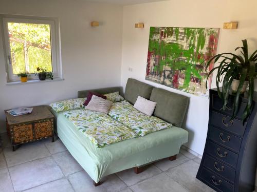 a living room with a couch and a table at Vulkanland Stoeckel - Feldbach in Feldbach