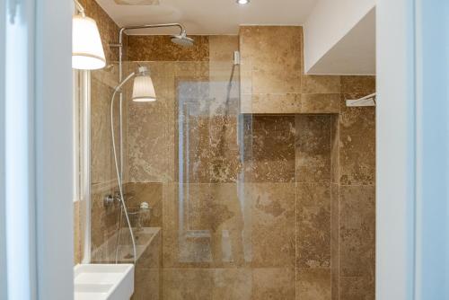 a bathroom with a shower and a sink at Alte Schule Reichenau an der Rax in Reichenau