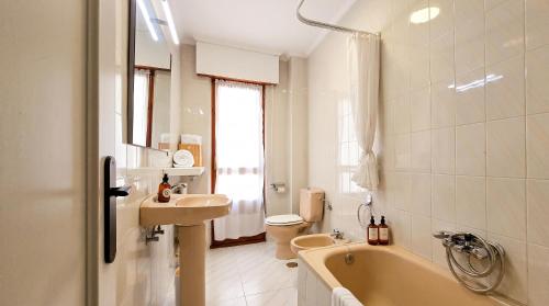 a bathroom with a tub and a sink and a toilet at Las Vistas in Suances