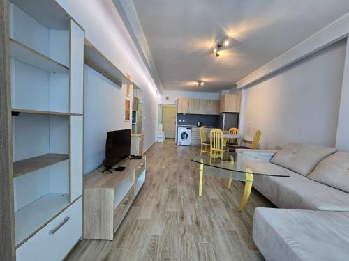 a living room with a couch and a table at GOLD Residence in Sofia