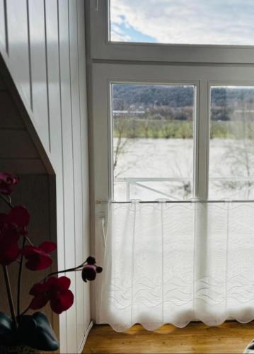 a window with a view of a snow covered field at Historisches Winzerhaus Lieser in Lieser