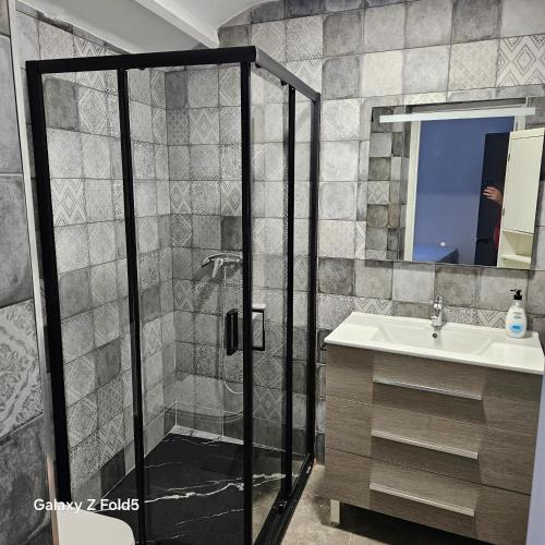 a bathroom with a shower and a sink at Aires de Benatae in Benatae