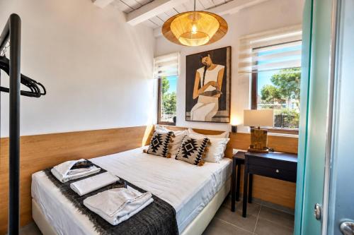 a bedroom with a bed and a window at Villa Ikaros in Agia Triada