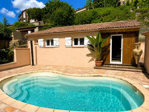 a swimming pool in front of a house at Casa Versini in Balogna