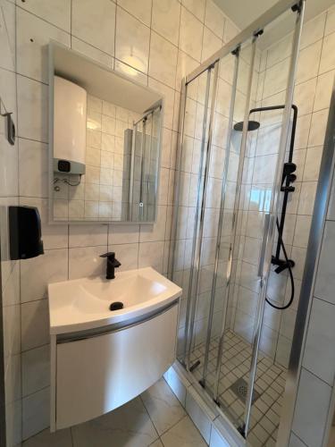 a bathroom with a sink and a shower at Villa Luna Maris in Starigrad