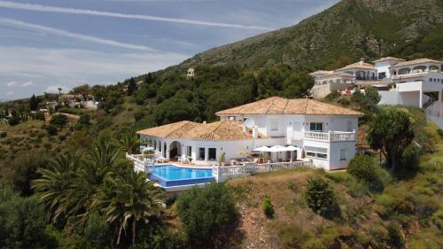 an aerial view of a house on a hill at Villa Mañana in Mijas