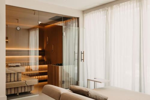 a living room with a bed and a couch at B Kaprun in Kaprun