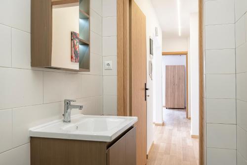 a bathroom with a sink and a mirror at Topfix Luxury Home 1 in Kos