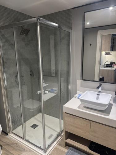 a bathroom with a shower and a sink at studio to Maho in Cupecoy