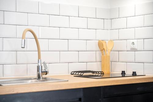 a kitchen counter with a sink and a cutting board at Topfix Luxury Home 2 in Kos