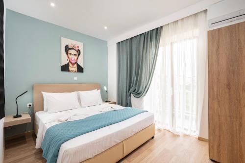 a bedroom with a bed and a large window at Topfix Luxury Home 2 in Kos